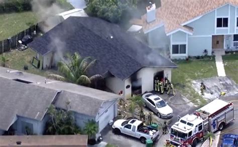 Crews work to put out house fire in Miramar